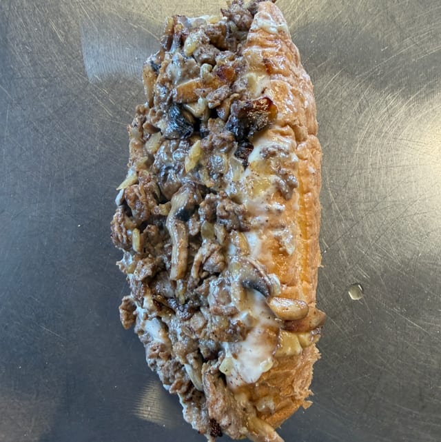 Famous Philly Cheesesteak W/Fries.